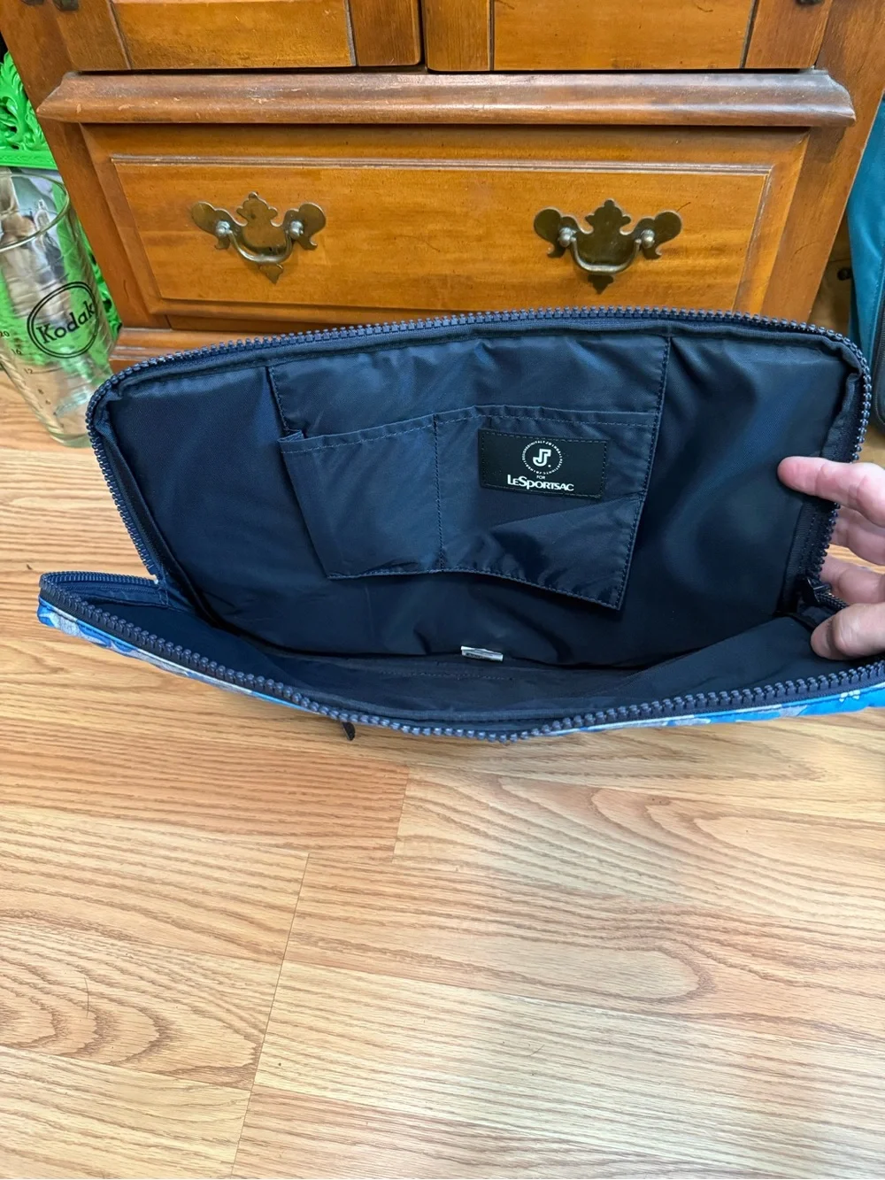 LeSportsac brand travel pouch or laptop case featuring a blue and grey hibiscus